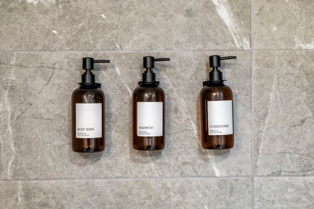Amber glass bath amenities on marble